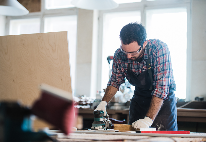 worker grinds the wood of angular grinding machine 2024 11 03 00 42 35 utc 1